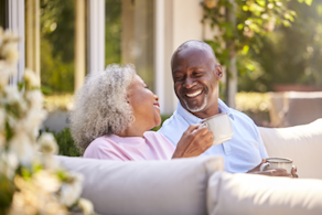 Life Assure Seniors Enjoying Coffee On Outdoor Couch Blog